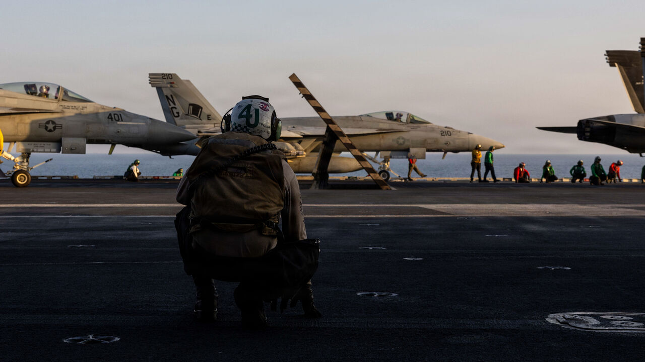 In this US Navy released handout, an F/A-18E Super Hornet, attached to Strike Fighter Squadron (VFA) 14, prepares to take off from the flight deck of Nimitz-class aircraft carrier USS Abraham Lincoln (CVN 72) in support of Operation Epic Fury on March 1, 2026 at Sea. 