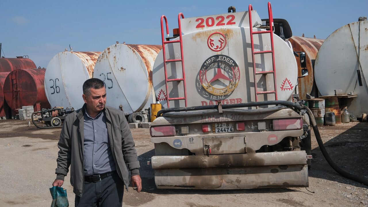 A worker at a market for fuel oil and automotive fuel on March 17, 2026, in Erbil, Iraq. 