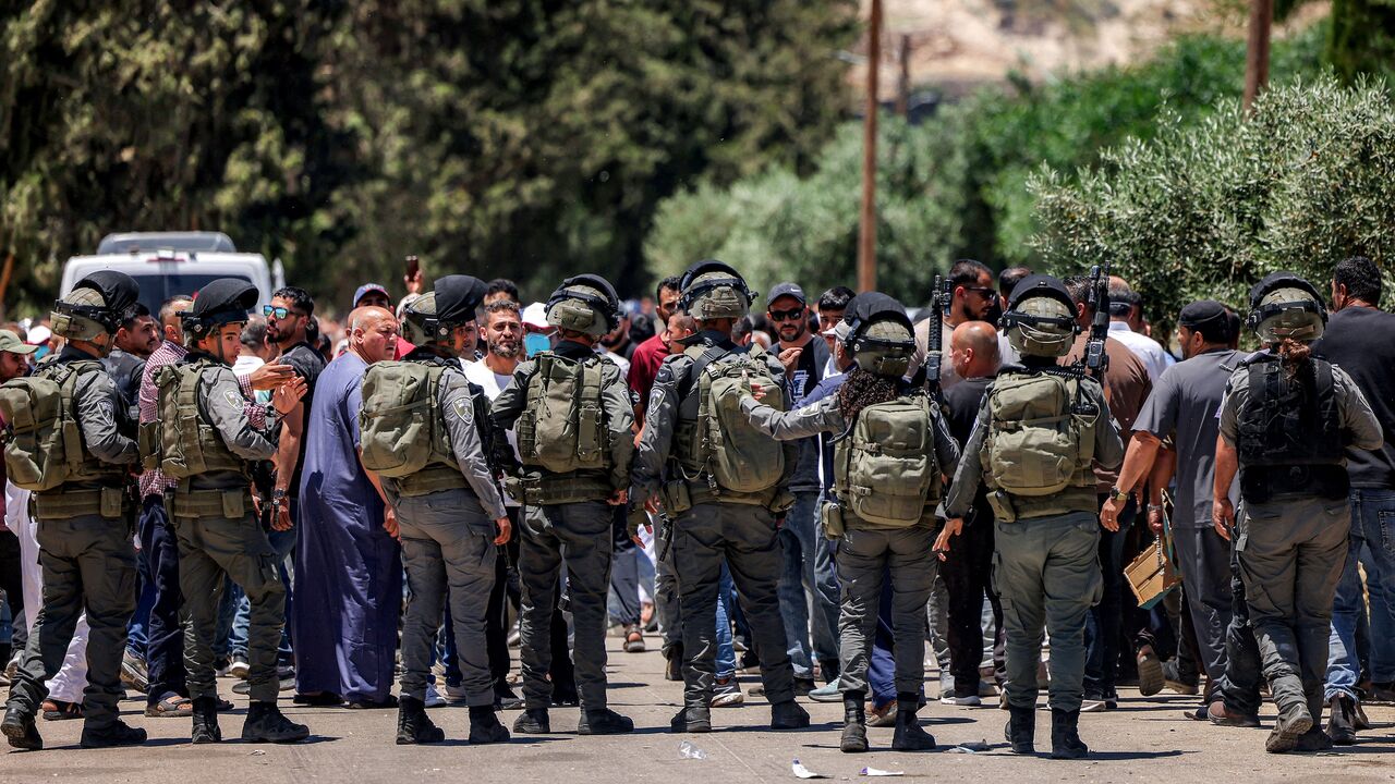 Israeli security forces attempt to disperse Palestinians who had gathered to protest the reported burning of land by Israeli settlers in the Palestinian village of Idna, west of Hebron in the occupied West Bank, on June 5, 2026.