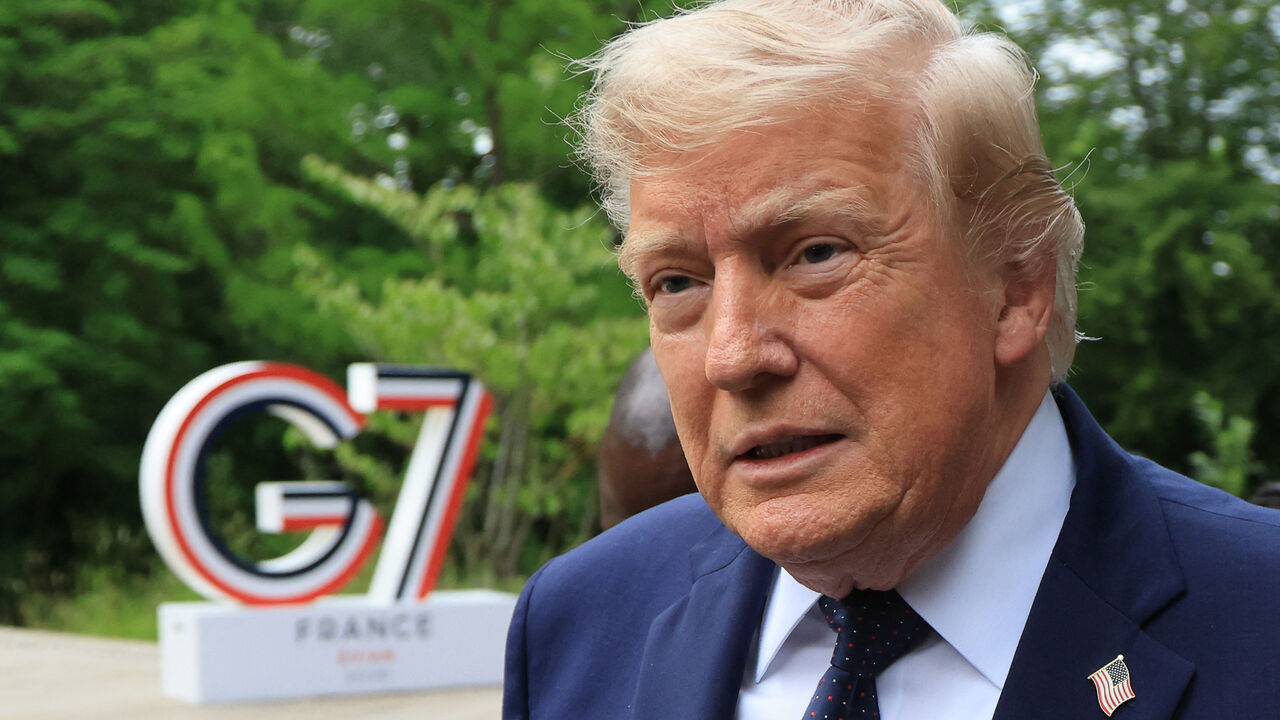 US President Donald Trump arrives to attend a musical interlude before a gala dinner as part of the G7 summit, in Evian, eastern France, on June 16, 2026. 
