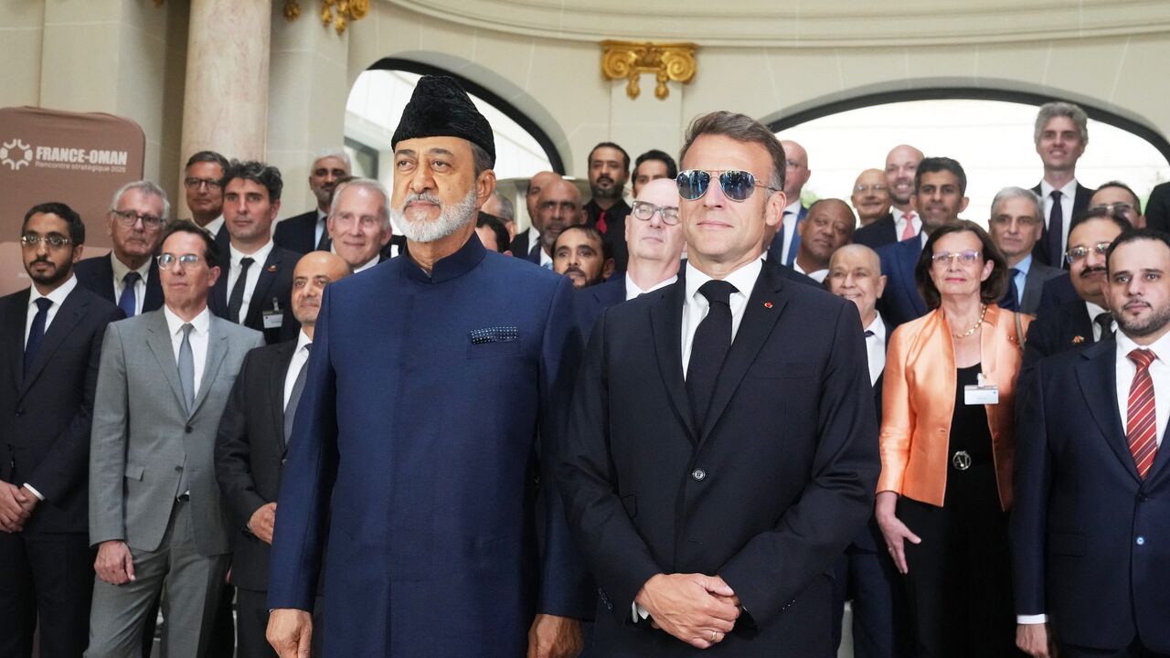 French President Emmanuel Macron (L) and Oman's Sultan Haitham bin Tarik pose during a meeting with business leaders in Paris on June 29, 2026. 