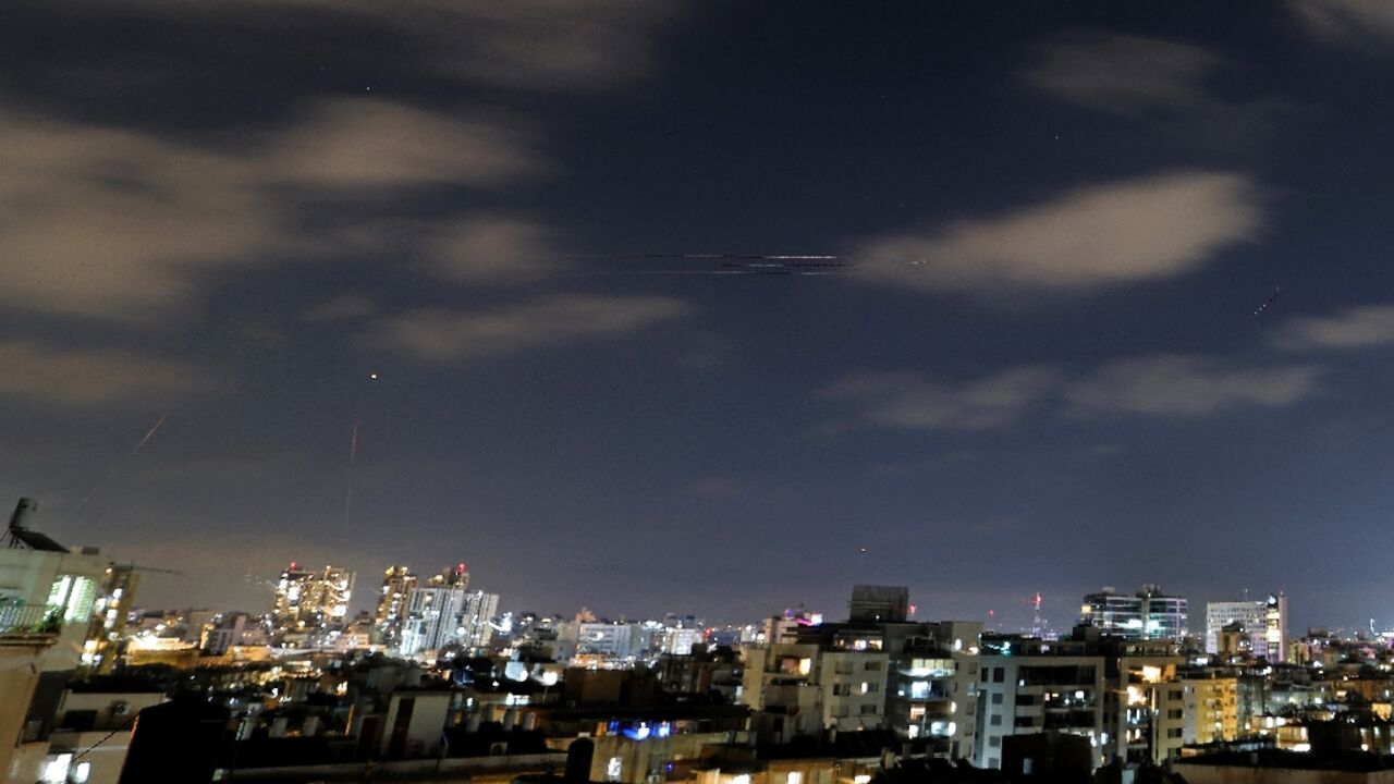 Rocket trails are seen above the Israeli coastal city of Netanya, as air raid sirens sounded in the country to warn of incoming Iranian missiles for the first time since an April 2026 ceasefire took hold in the Middle East war