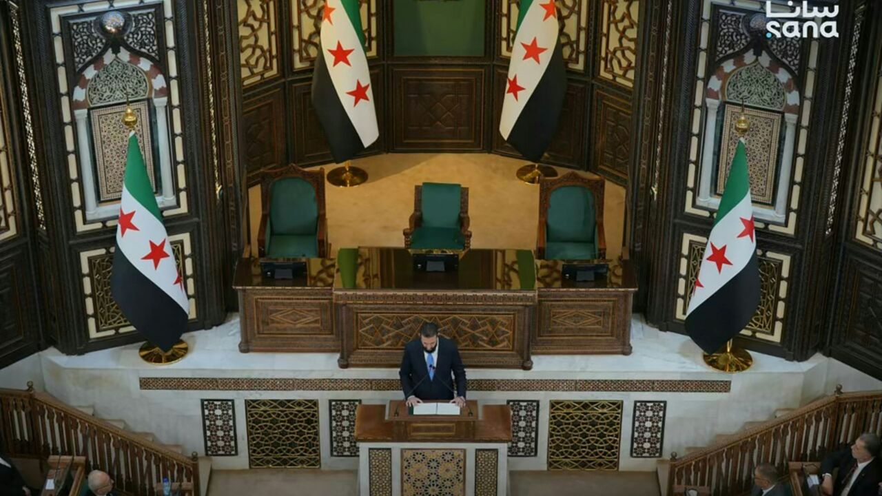 This handout picture taken and released by the official Syrian Arab News Agency shows Syria's President Ahmed al-Sharaa speaking during the first meeting of the transitional parliament in Damascus