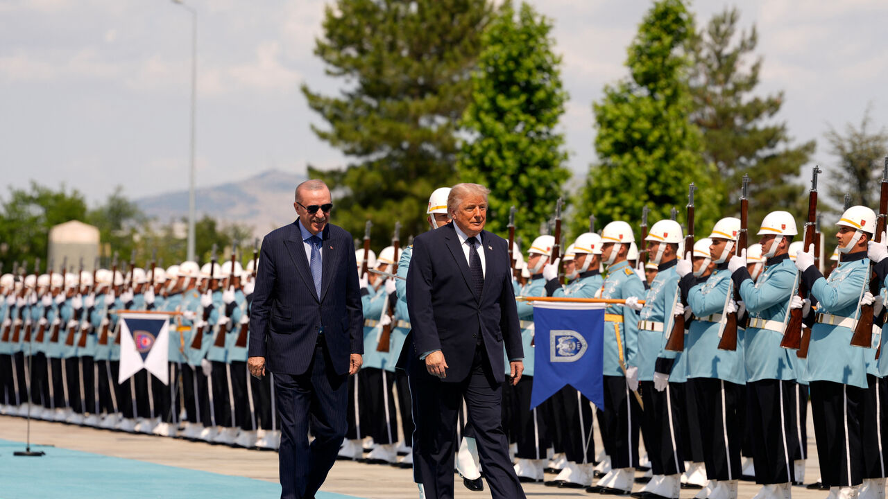 U.S. President Donald Trump walks with Turkish President Recep Tayyip Erdogan during a formal arrival at the Bestepe Presidential Compound at the NATO summit in Ankara, Turkey, Tuesday, July 7, 2026.     Emrah Gurel/Pool via REUTERS