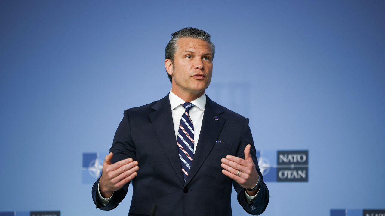 U.S. Defense Secretary Pete Hegseth talks to the media on the day of a meeting of NATO defence ministers at the alliance's headquarters in Brussels, Belgium, June 18, 2026. REUTERS/Stoyan Nenov