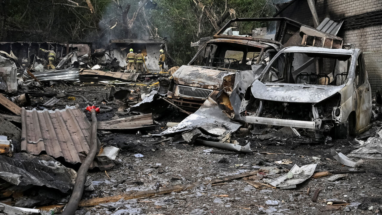 Rescuers work at a site of a Russian air strike, amid Russia's attack on Ukraine, in Zaporizhzhia, Ukraine July 8, 2026. REUTERS/Stringer