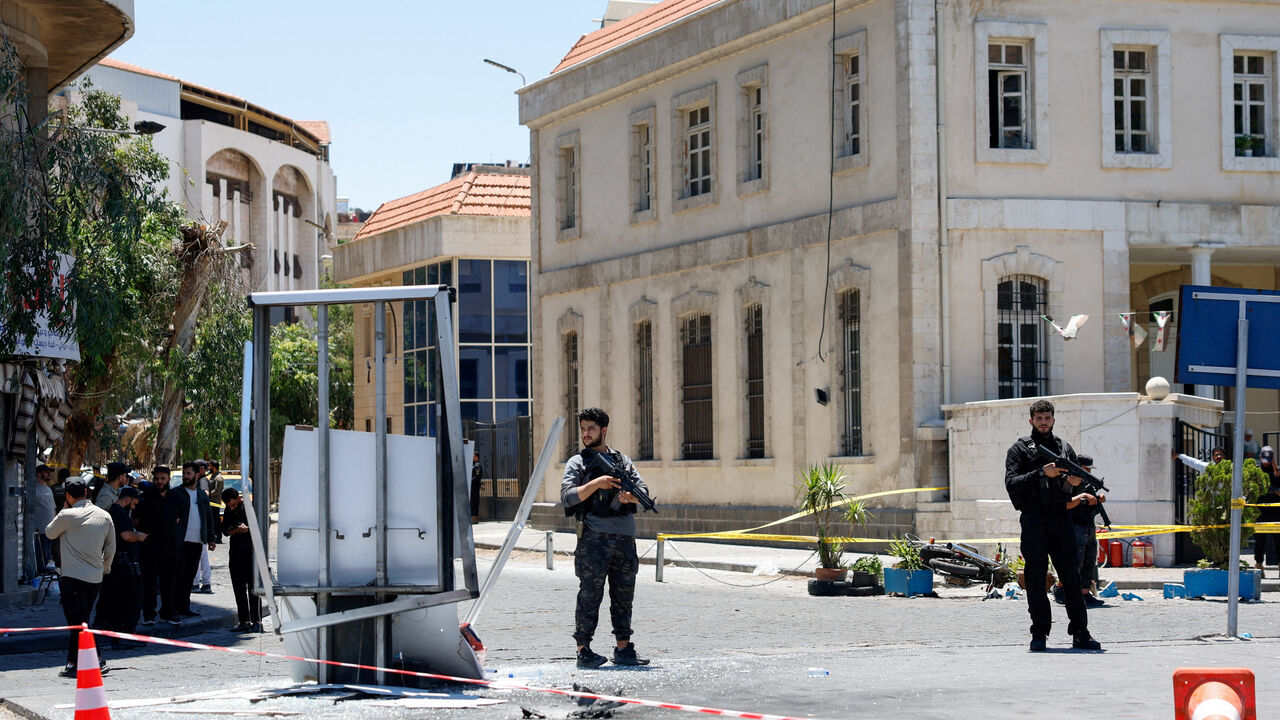 A cordoned-off area and a damaged structure in the aftermath of explosions near a hotel where French President Emmanuel Macron was meant to be staying, in Damascus, Syria, July 7, 2026. REUTERS/Yamam Al Shaar