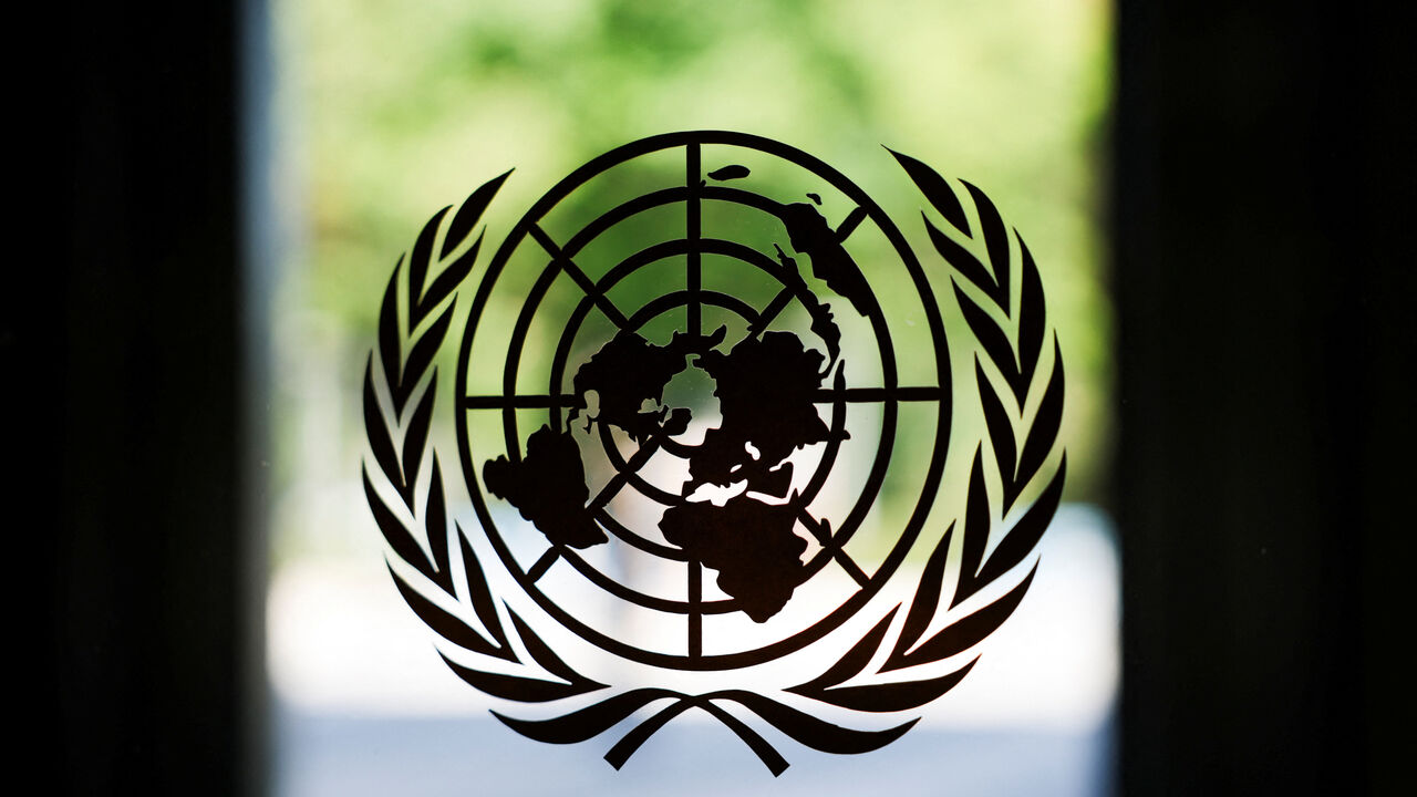 The United Nations logo adorns a window at U.N. headquarters in New York City, U.S., September 18, 2025. REUTERS/Jeenah Moon/File Photo