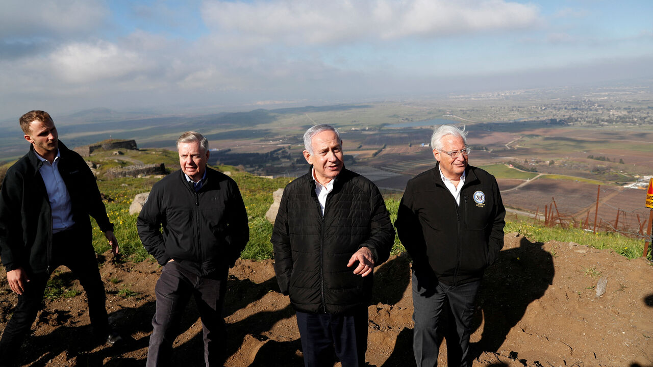 FILE PHOTO: Israeli Prime Minister Benjamin Netanyahu, U.S. Republican Senator Lindsey Graham and U.S. Ambassador to Israel David Friedman visit the border line between Israel and Syria at the Israeli-occupied Golan Heights March 11, 2019. REUTERS/Ronen Zvulun/File Photo