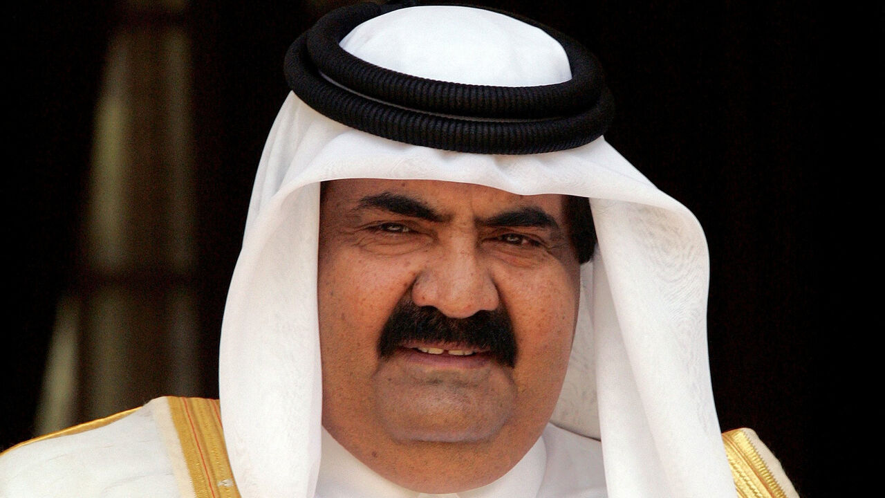 FILE PHOTO: The emir of Qatar, Sheikh Hamad bin Khalifa al-Thani, looks on before his meeting with Indian Prime Minster Manmohan Singh (not in picture) in New Delhi, India April 14, 2005. REUTERS/B Mathur/File Photo