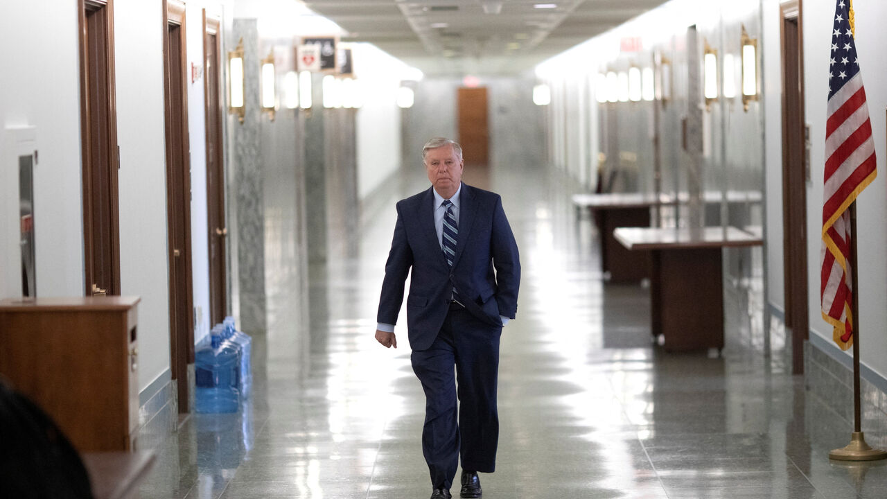 FILE PHOTO: U.S. Senator Lindsey Graham (R-S.C.) walks through the Dirksen Senate Office Building before Judiciary Committee hearing at the U.S. Capitol in Washington, U.S., April 27, 2022. REUTERS/Tom Brenner/File Photo
