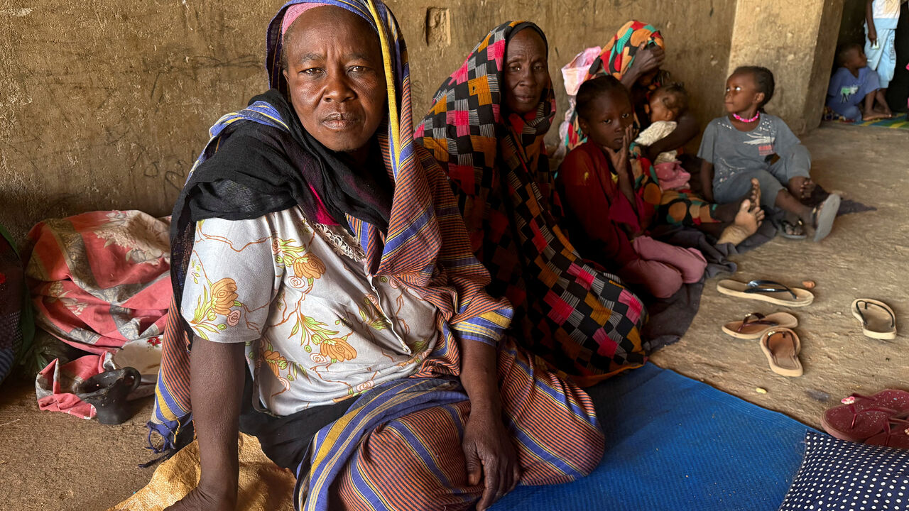 FILE PHOTO: Displaced women from South Kordofan sit on the ground in El Obeid, North Kordofan State, Sudan, January 15, 2026. REUTERS/El Tayeb Siddig/File Photo