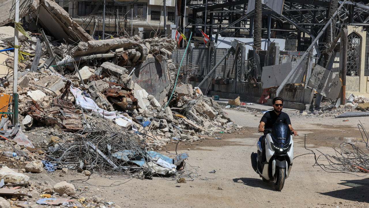 A man rides past the rubble of buildings damaged in Israeli strikes in Beirut’s southern suburbs, following a ceasefire agreement between Lebanon and Israel, in Beirut, Lebanon, July 6, 2026. REUTERS/Mohamed Azakir