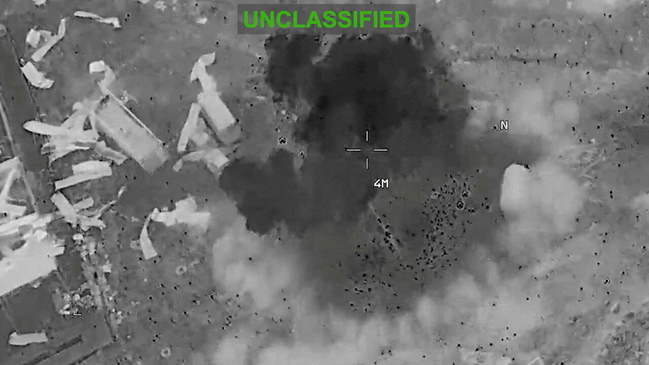 Scattered debris and smoke, at an unknown location, during what the U.S. Central Command (CENTCOM) says are strikes on Iran, in this screengrab taken from a handout video released on July 22, 2026.  U.S. Central Command/Handout via REUTERS