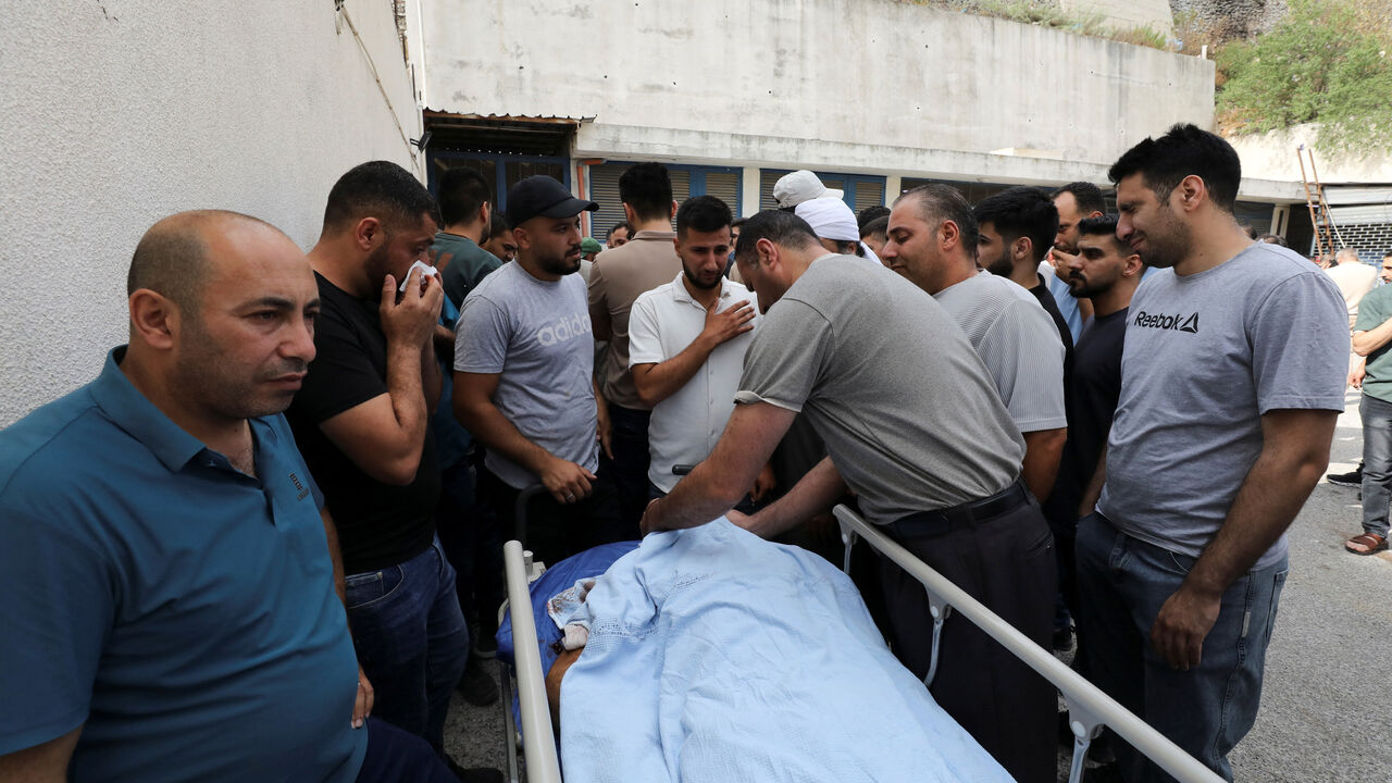 Palestinians gather around the body of a man who was killed during a confrontation with Israeli settlers, at a hospital in the Israeli-occupied West Bank city of Nablus, July 24, 2026.REUTERS/Nidal Eshtayeh