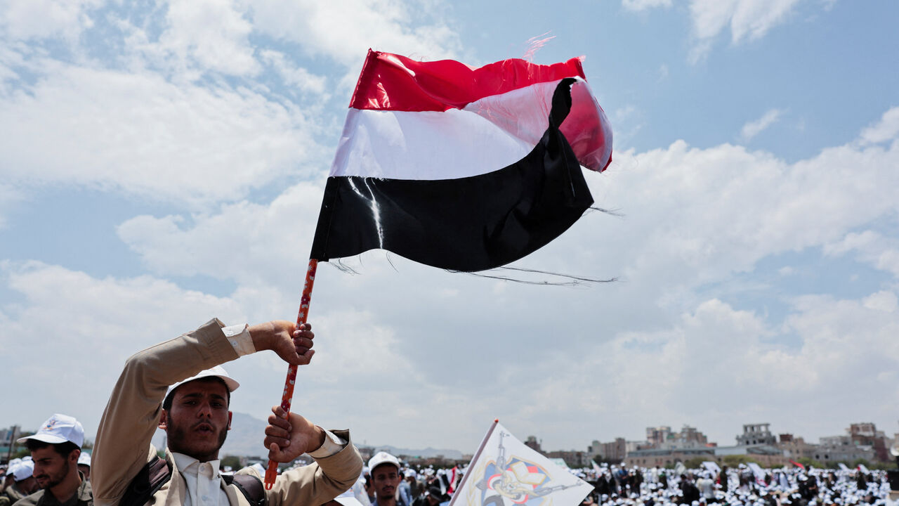 A student holds up a Yemeni flag during a parade at Sanaa University campus to show support for the Houthis amid an escalation with Saudi Arabia, in Sanaa, Yemen July 22, 2026. REUTERS/Khaled Abdullah