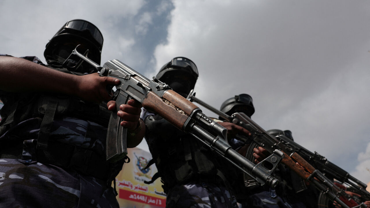 FILE PHOTO: Members of Houthi security force stand guard as Houthi supporters rally against the Saudi-led coalition's restrictions on Houthi-controlled areas, which the group describes as a blockade, in Sanaa, Yemen, July 17, 2026. REUTERS/Khaled Abdullah/ File Photo