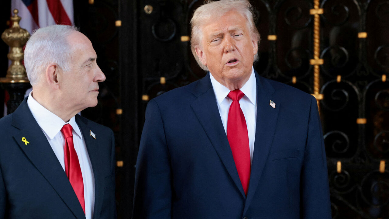 FILE PHOTO: U.S. President Donald Trump speaks next to Israeli Prime Minister Benjamin Netanyahu upon arrival for meetings at Trump's Mar-a-Lago club in Palm Beach, Florida, U.S., December 29, 2025. REUTERS/Jonathan Ernst/File Photo
