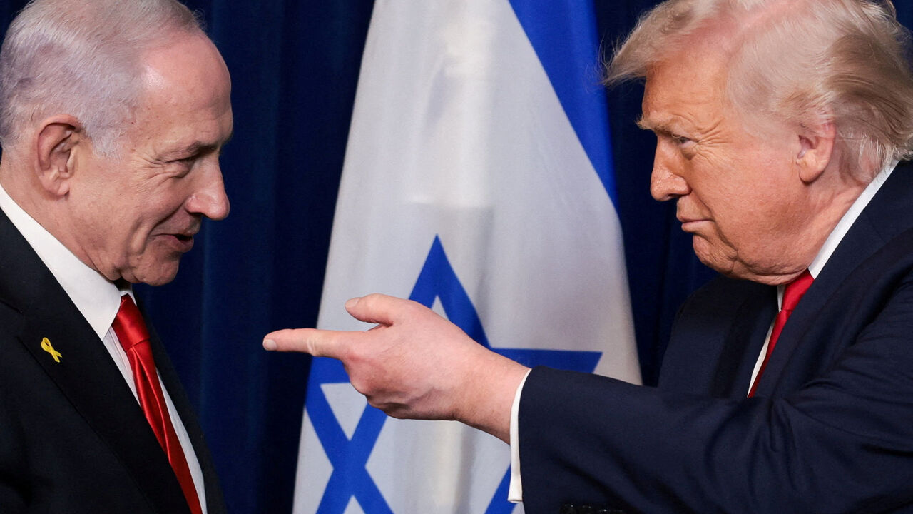 FILE PHOTO: U.S. President Donald Trump points his finger towards Israeli Prime Minister Benjamin Netanyahu during a press conference after meeting at Trump?s Mar-a-Lago club in Palm Beach, Florida, U.S., December 29, 2025. REUTERS/Jonathan Ernst/File Photo