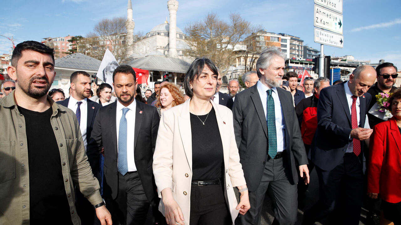FILE PHOTO: Newly elected Uskudar Mayor Sinem Dedetas, accompanied by her husband Baris Dedetas, walks at Uskudar Square after receiving her mayoral certificate, in Istanbul, Turkey April 4, 2024. REUTERS/Dilara Senkaya/File Photo