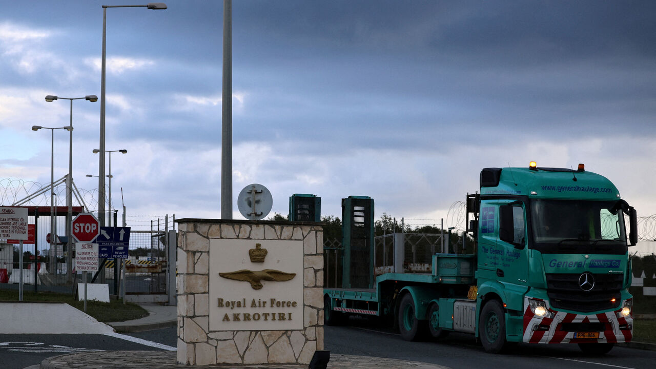 FILE PHOTO: A  truck exits RAF Akrotiri, a British sovereign base in Cyprus, March 24, 2026. REUTERS/Yiannis Kourtoglou/File Photo