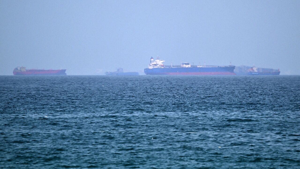 Vessels are pictured off the coast of the Khor Fakkan Container Terminal, a major UAE container port near Oman, in the same region where three tankers were struck