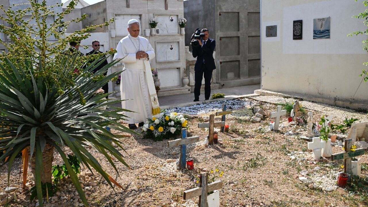 Pope Leo XIV prayed after laying a wreath of flowers on the unmarked graves of shipwreck victims at a cemetery on Lampedusa island