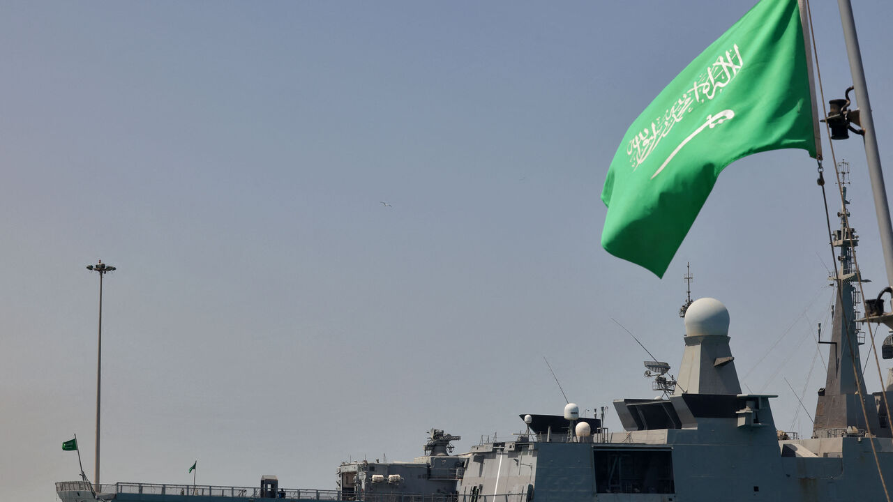 A Saudi navy ship is pictured docked at King Faisal navy base in Jeddah before the departure of a team to Port Sudan to help with the evacuation efforts of people fleeing Sudan, on April 29, 2023. 