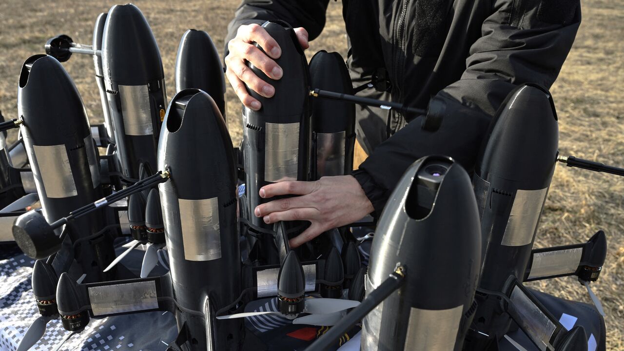 An employee of the Ukrainian SkyFall company checks a P1-Sun interceptor drone before a test flight at an undisclosed location in Ukraine on March 19, 2026,