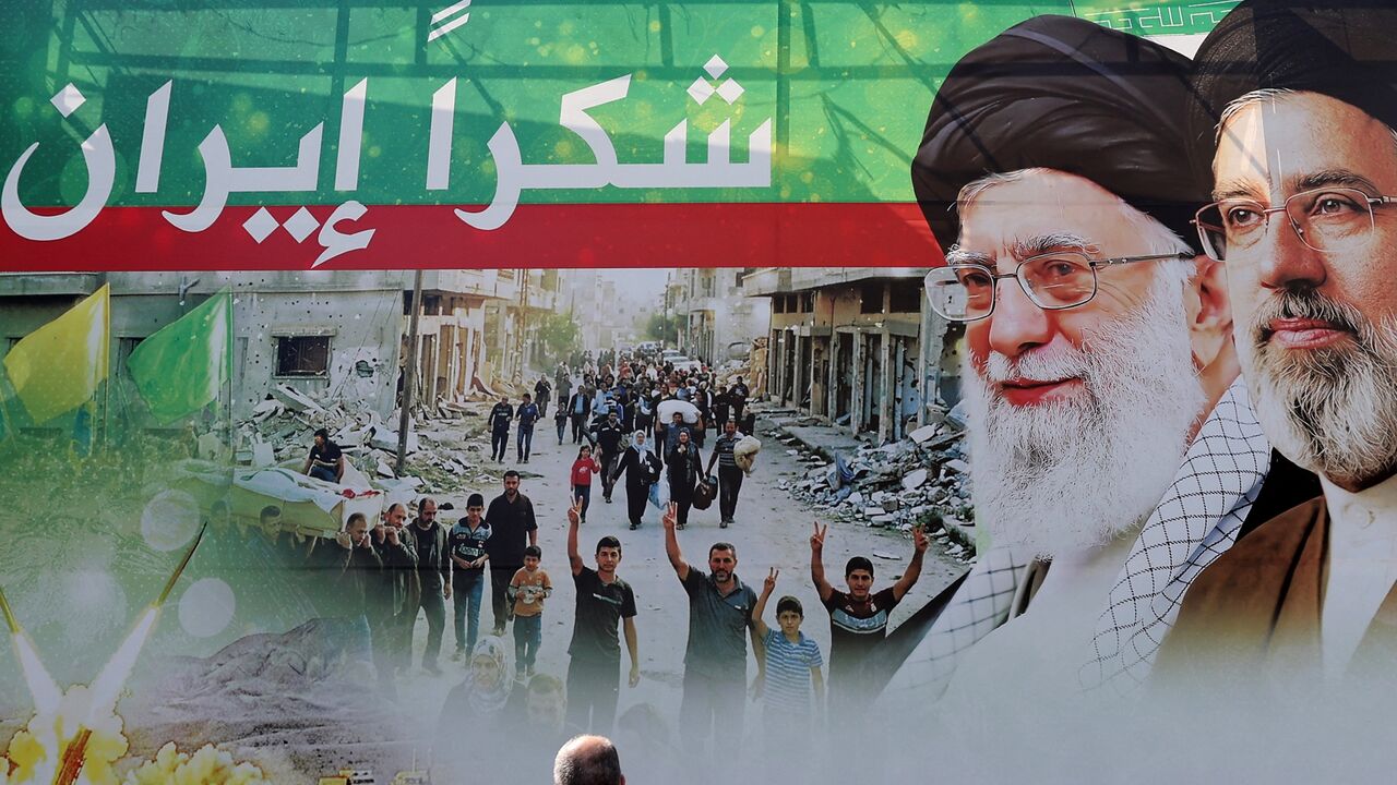 A giant billboard depicts late Iranian leader Ayatollah Ali Khamenei (2nd L), and his son Iranian Supreme Leader Ayatollah Mojtaba Khamenei, with Arabic writing that reads: "Thank you Iran," in Dahiyeh, Beirut's southern suburbs, on June 15, 2026. 