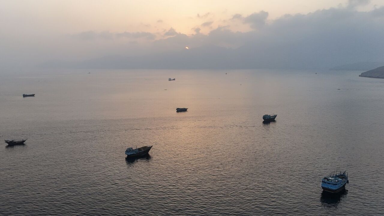 This aerial photograph shows boats anchored off Oman's northern Musandam Peninsula near the Strait of Hormuz on June 27, 2026. — AFP via Getty Images