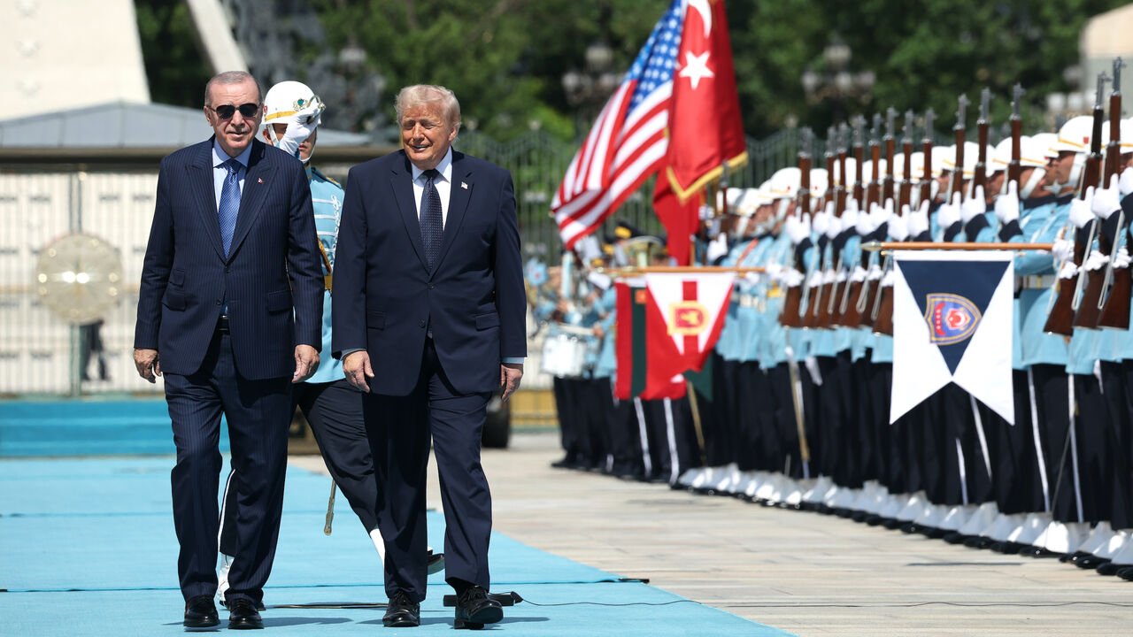 US President Donald Trump walks with Turkish President Recep Tayyip Erdogan during a state arrival ceremony at the Bestepe Presidential Complex for the annual NATO Summit on July 7, 2026 in Ankara, Turkey.