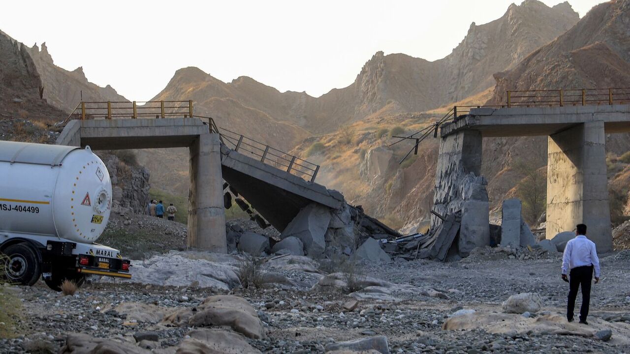 A heavily damaged bridge hit by a US strike is pictured along the road connecting Roudan and Bandar Abbas in southern Iran on July 18, 2026. — Amir Hossein KHORGOOEI / ISNA / AFP via Getty Images