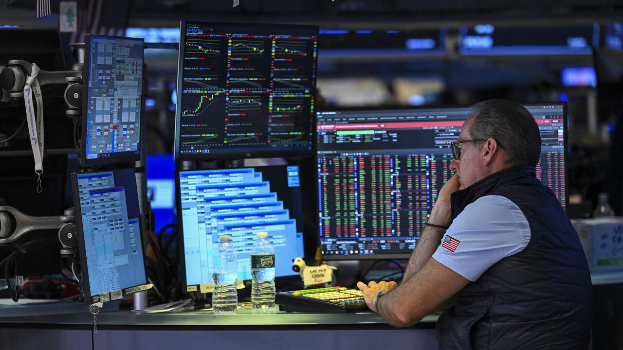 A trader works on the floor of the New York Stock Exchange on July 24, 2026, in New York. 