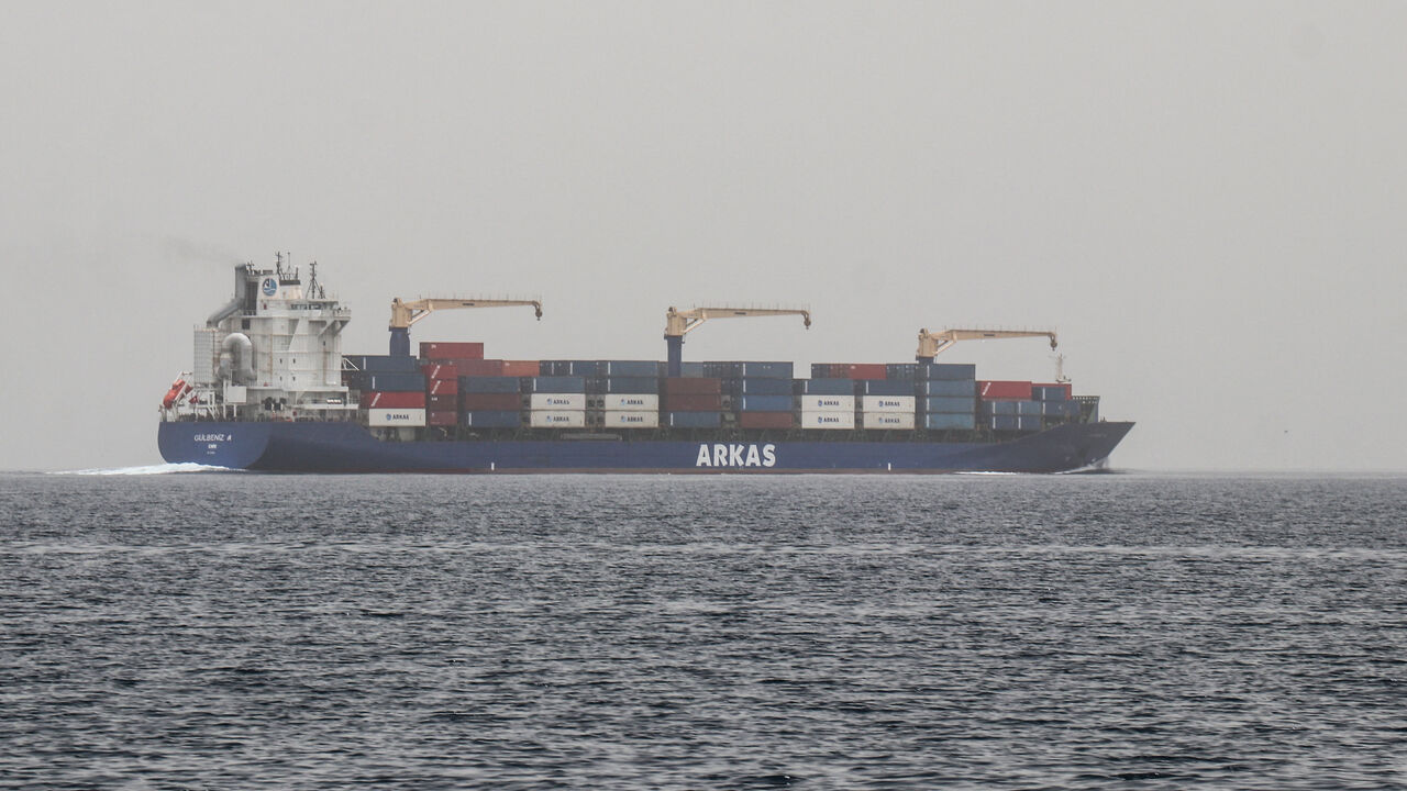 A commercial vessel passes through an international shipping lane off Yemen's Hanish Island in the Red Sea on July 27, 2026. 