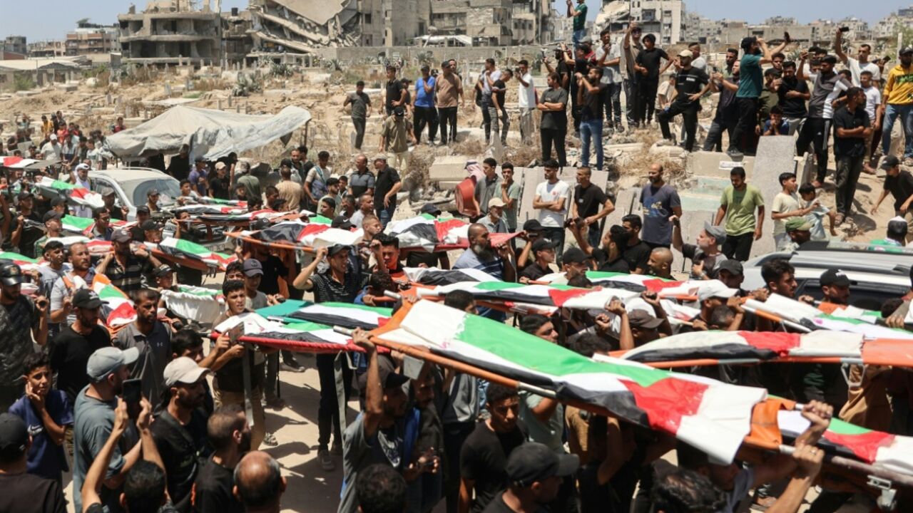 Palestinian mourners attend the funeral of members of the Abu Sharia and al-Hasayna families, whose remains were recently recovered from the rubble of the al-Sabra neighbourhoodstruck by Israeli bombardments in November 2023, in Gaza City on August 4, 2026