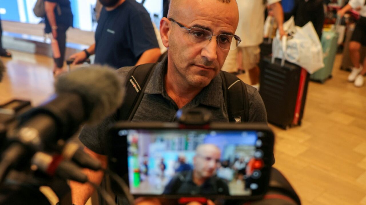 US-Palestinian dual citizen Louai Abu Ridi, whose home in the occupied West Bank village of Qusra is besieged by Israeli settlers, speaks to reporters upon arrival at Israel's Ben Gurion Airport