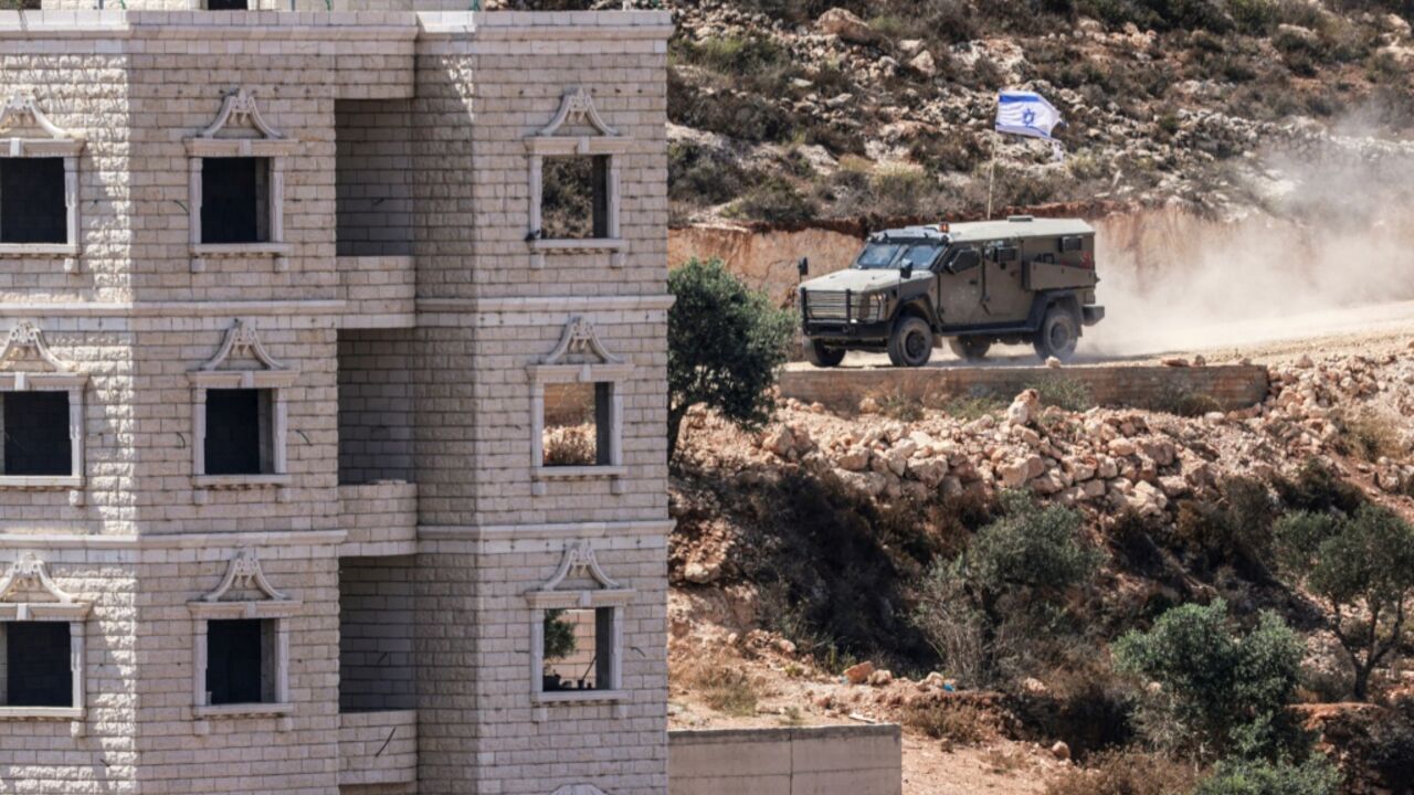 Israeli soldiers arrive in the village of Qusra after a group of settlers occupied a building while Palestinians were inside