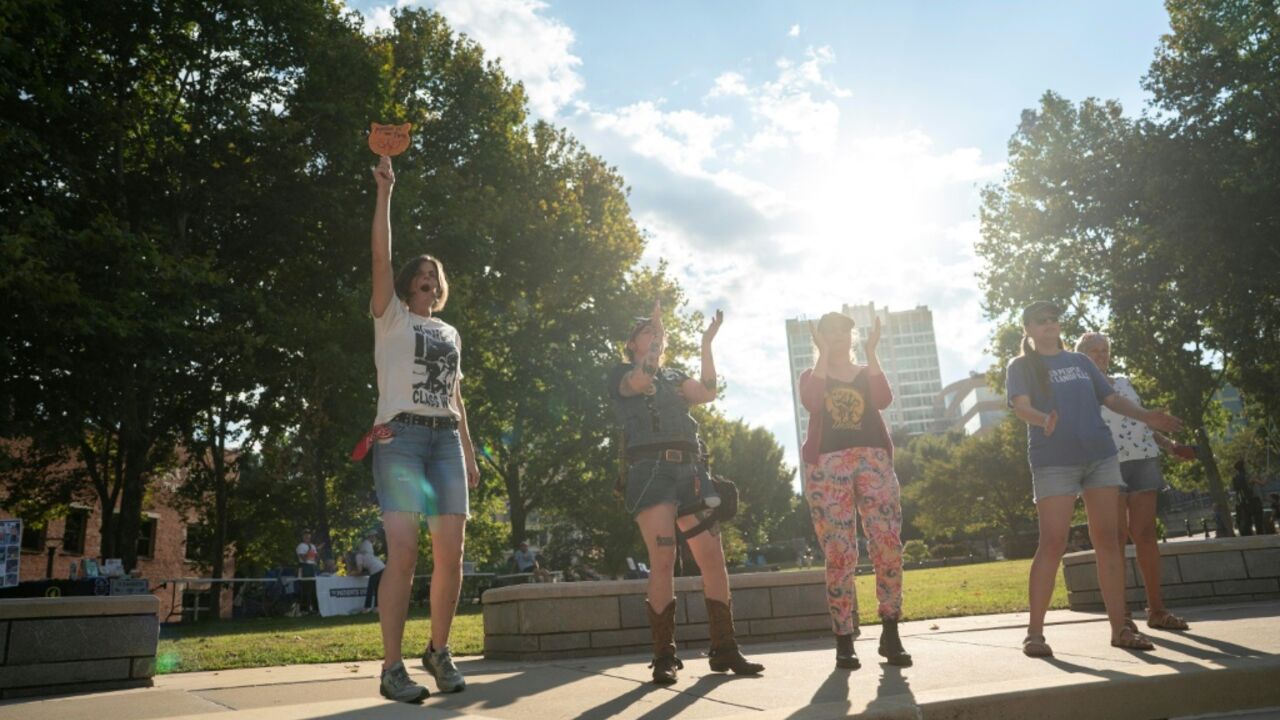 People cheer at a protest against the G20 finance ministers and central bank governors’ meeting in Asheville, North Carolina