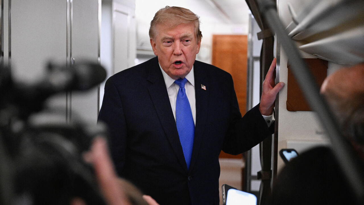 FILE PHOTO: U.S. President Donald Trump speaks to the media aboard Air Force One en route to Joint Base Andrews, in Maryland, U.S., August 2, 2026. REUTERS/Daniel Heuer/File Photo