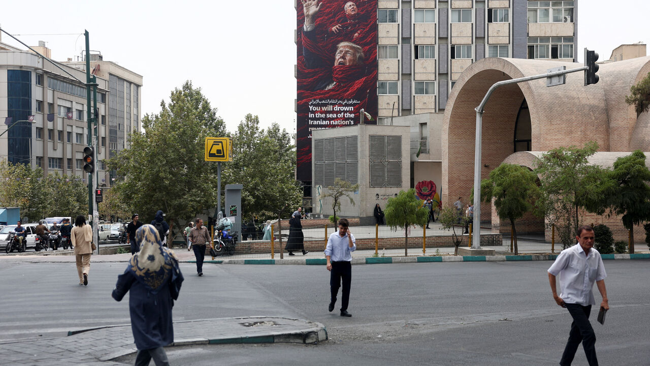 A billboard depicting U.S. President Donald Trump and Israeli Prime Minister Benjamin Netanyahu that reads "You will drown in the sea of the Iranian nation's revenge", on a building in Tehran, Iran, August 3, 2026. Majid Asgaripour/WANA (West Asia News Agency) via REUTERS