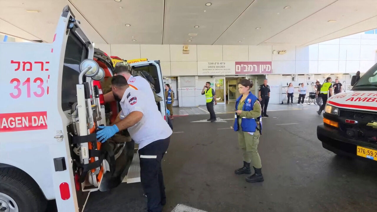 Paramedics work to move an Israeli casualty from inside an ambulance, after being wounded in an explosion in Lebanon, at Rambam Health Care Campus in Haifa, Israel, August 5, 2026. Rambam Health Care Campus/Handout via REUTERS