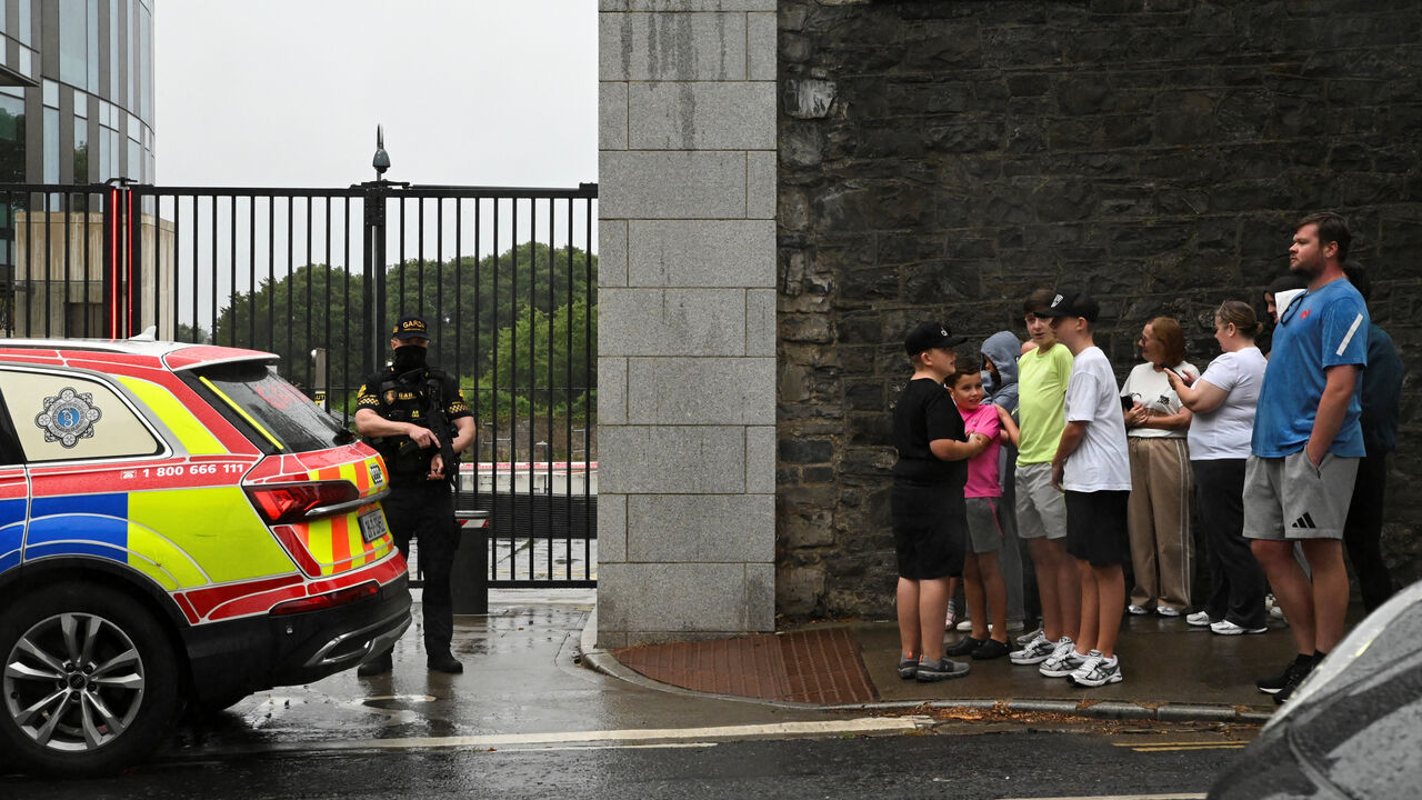 People gather outside the Special Criminal Court where alleged Irish crime gang boss Daniel Kinahan is due to appear on charges of organised criminal activity after being extradited to Ireland from the United Arab Emirates (UAE), in Dublin, Ireland, August 9, 2026. REUTERS/Natalia Campos