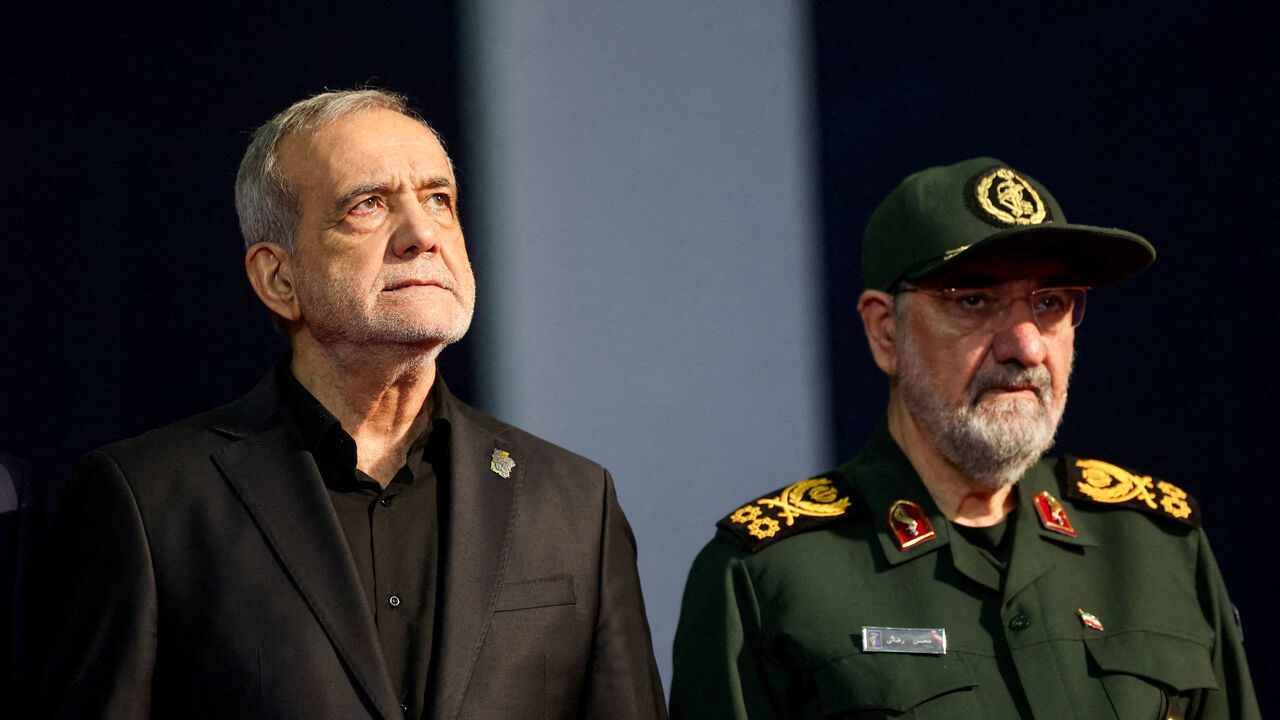 FILE PHOTO: Iranian President Masoud Pezeshkian and adviser to Iran's supreme leader Mohsen Rezaei attend a farewell ceremony for Iran's late Supreme Leader Ayatollah Ali Khamenei, who was killed on February 28 during Israeli and U.S. airstrikes on Iran, for international delegates at the Imam Khomeini Grand Mosalla in Tehran, Iran, July 3, 2026.  REUTERS/Mohammed Salem/File Photo
