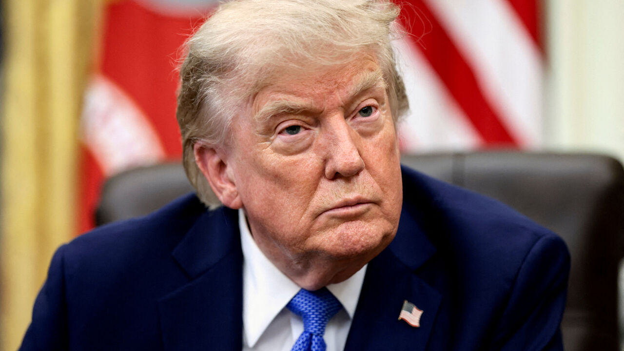 FILE PHOTO: U.S. President Donald Trump attends an event to sign executive orders related to birthright citizenship and the polysilicon industry, in the Oval Office at the White House in Washington, D.C., U.S., August 6, 2026. REUTERS/Evelyn Hockstein/File Photo