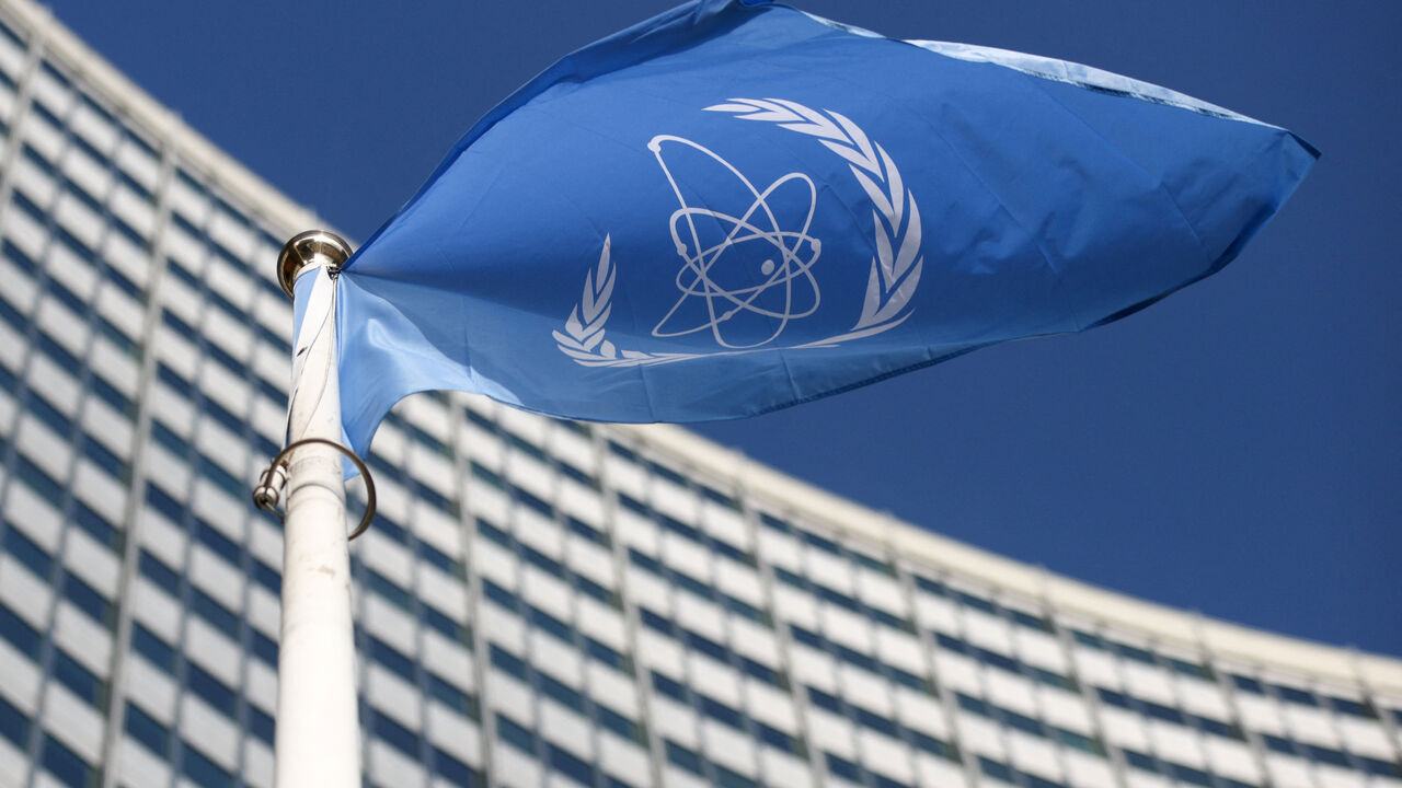 A flag with the logo of the International Atomic Energy Agency (IAEA) waves in front of the IAEA headquarters in Vienna, Austria, March 1, 2021. REUTERS/Lisi Niesner