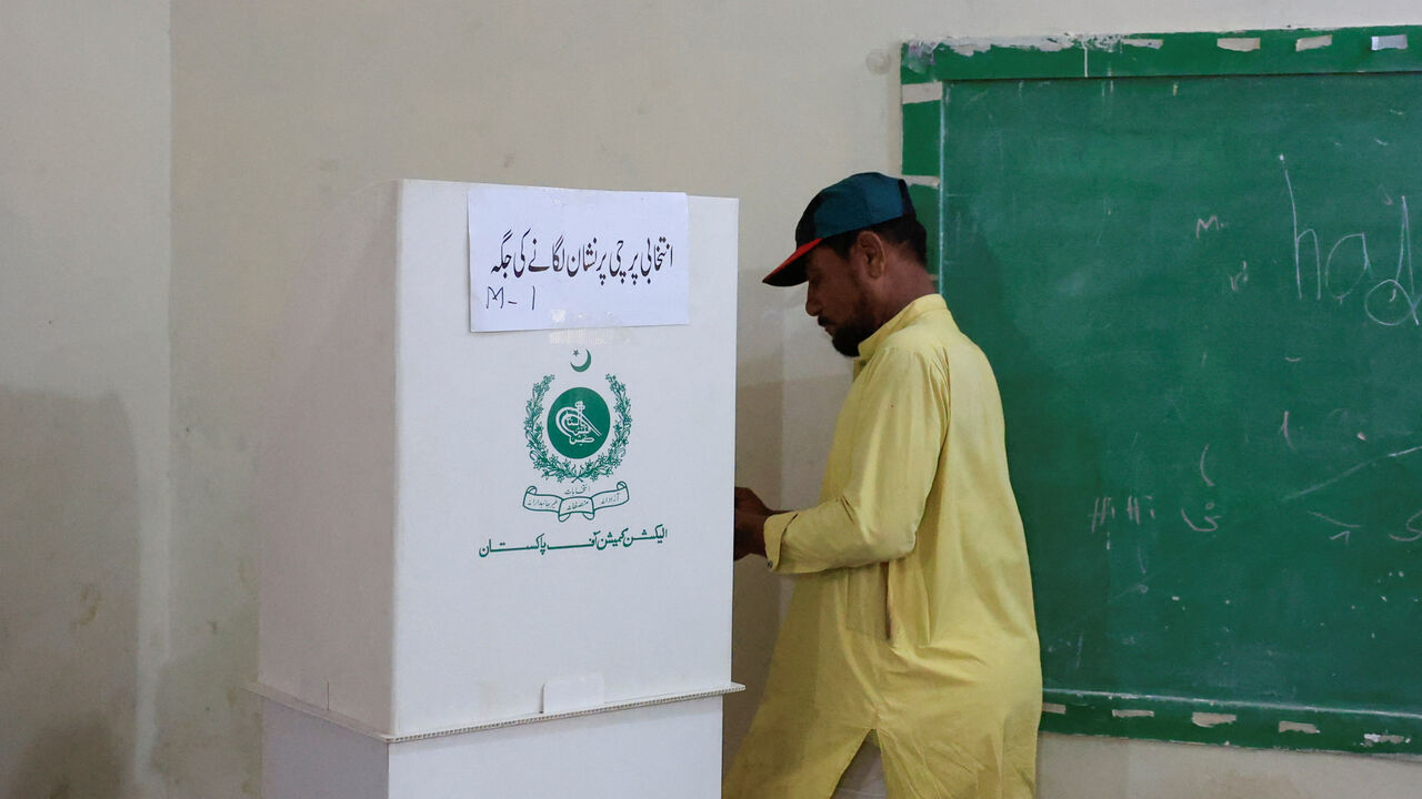 A man votes during the second phase of the Azad Jammu and Kashmir (AJK) Legislative Assembly elections at a polling station in Karachi, Pakistan, August 2, 2026. REUTERS/Akhtar Soomro