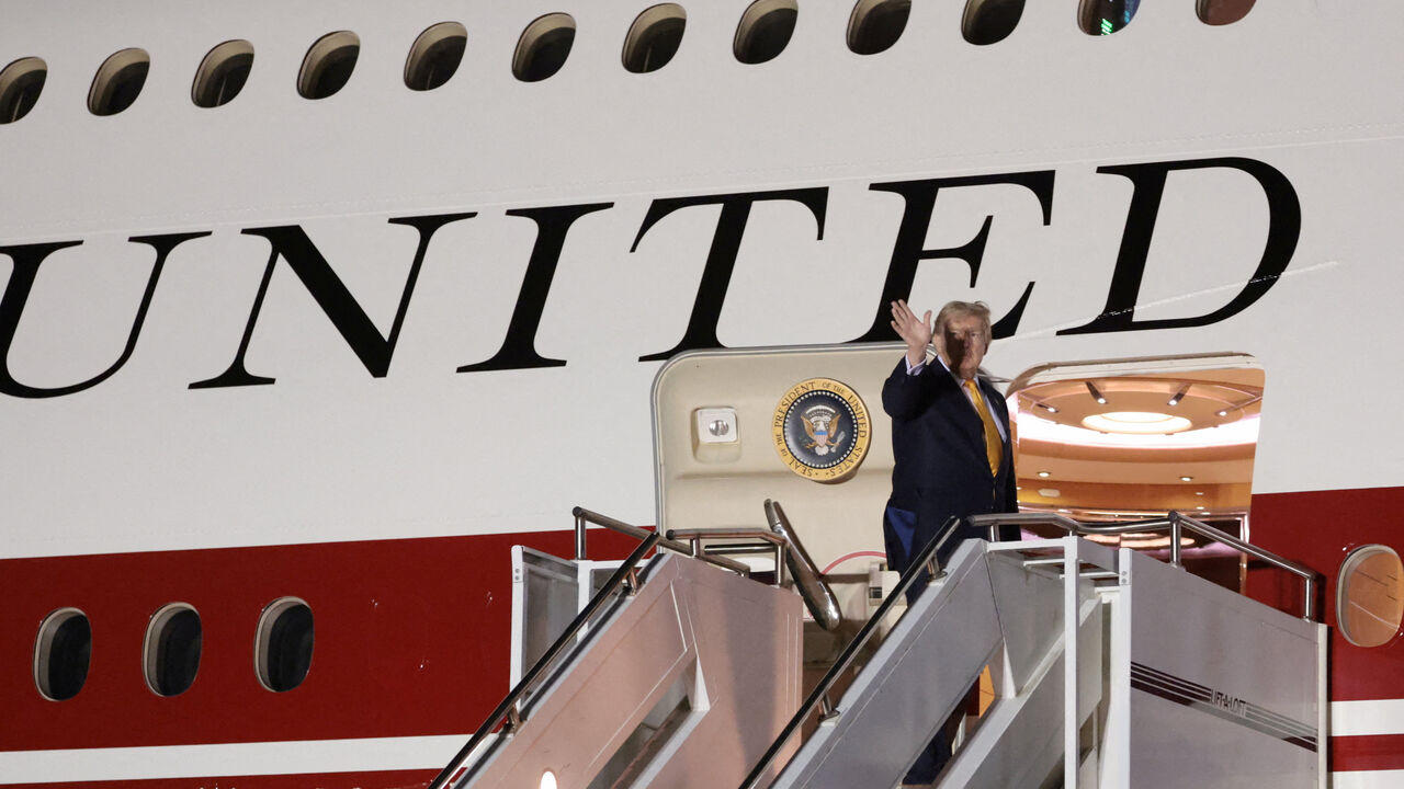 FILE PHOTO: U.S. President Donald Trump boards the new, Qatari-gifted Air Force One after arriving on one of the older planes operating as Air Force One, to return to Washington after his participation in a NATO leaders summit in Turkey, at RAF Mildenhall, in Suffolk, Britain, July 8, 2026. REUTERS/Jonathan Ernst/File Photo