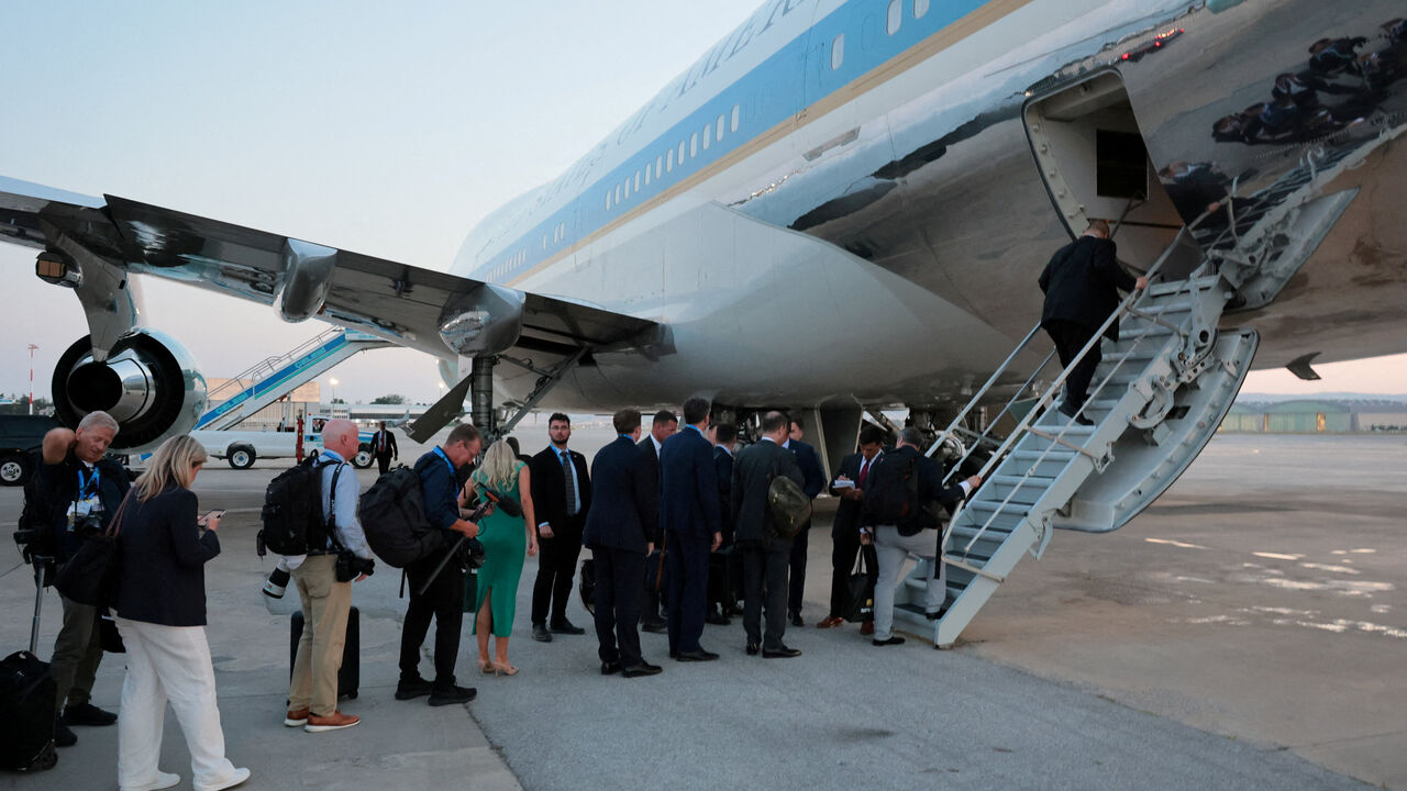 FILE PHOTO: People board Air Force One carrying U.S. President Donald Trump, en route to Washington after his participation in the NATO leaders' summit, at Ankara Esenboga Airport in Ankara, Turkey, July 8, 2026. REUTERS/Jonathan Ernst/File Photo
