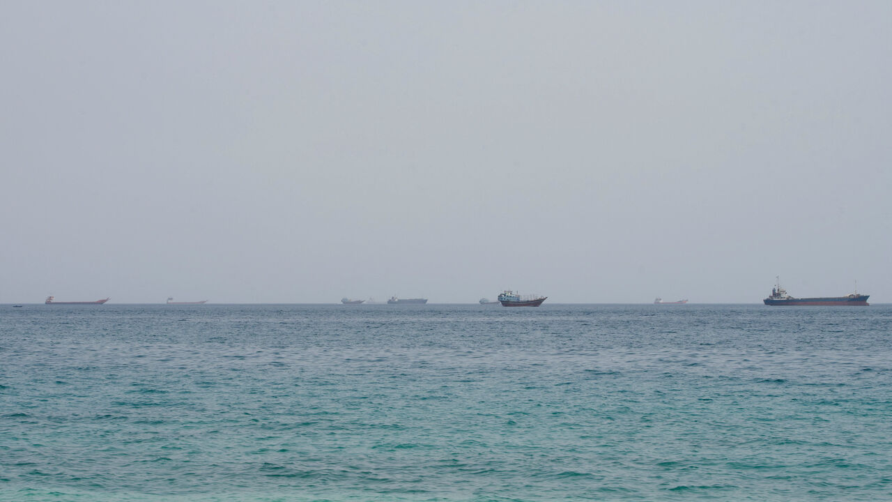 FILE PHOTO: Vessels near the Strait of Hormuz, as seen from Musandam, Oman, August 10, 2026. REUTERS/Stringer/File Photo